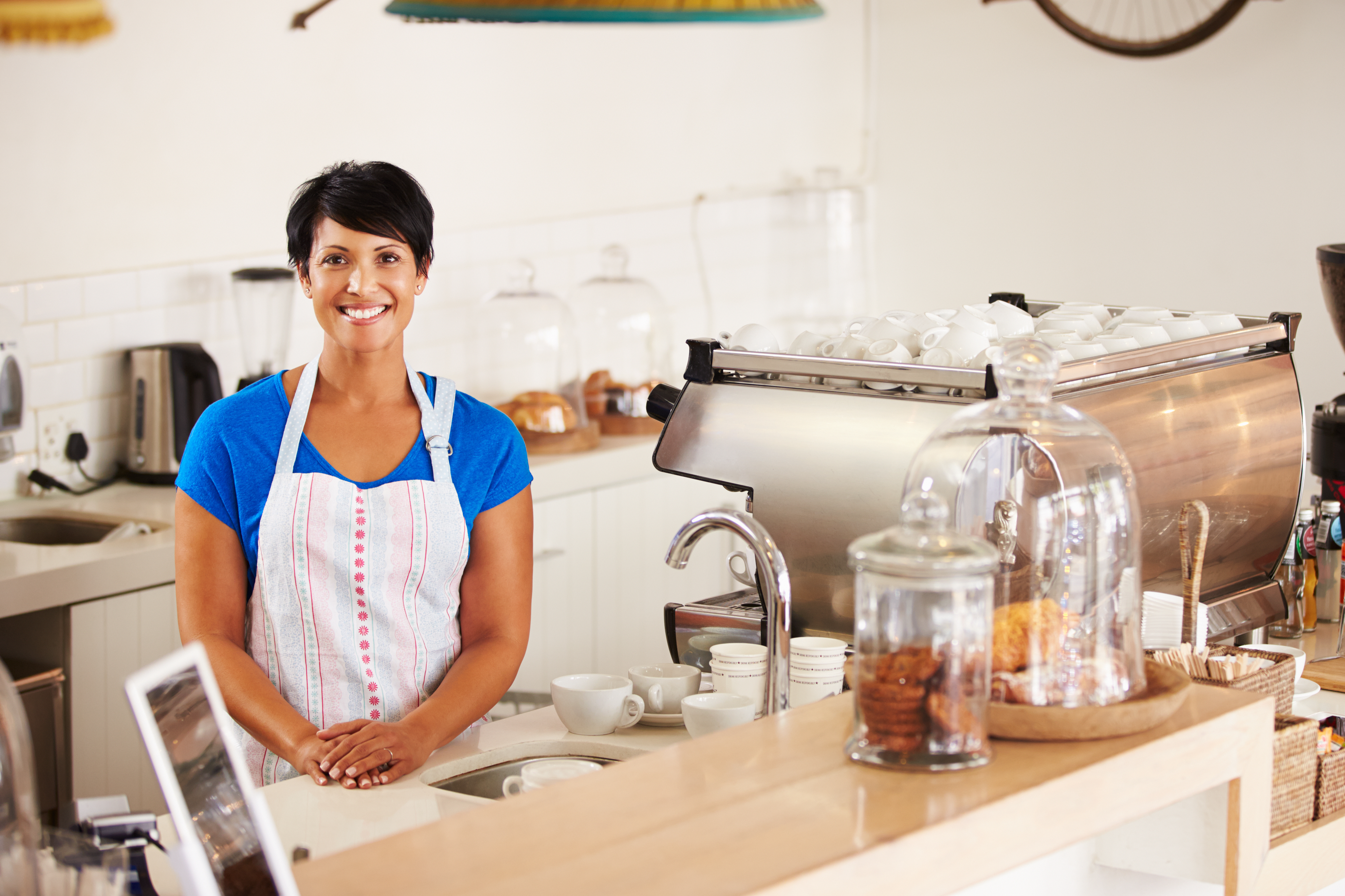 Woman in coffee shop smiling